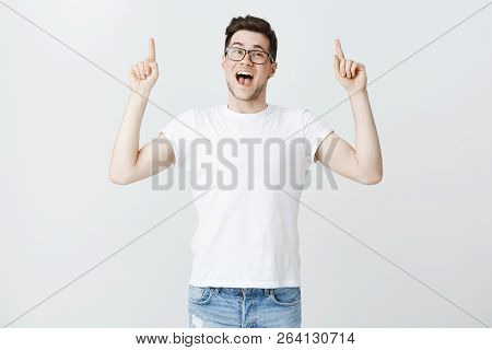 Jaw Drops As Prise Falls. Portrait Of Impressed Excited And Joyful Attractive Young Male Friend Rais