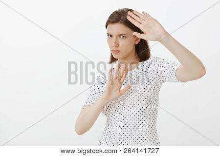 Girl Gonna Protect Herself From Paparazzi. Portrait Of Intense Angry And Annoyed Woman, Covering Bod