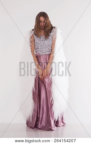 Girl In Pink Dress With Angel Wings On White Background. Angel-woman