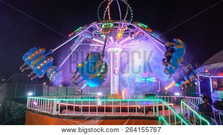 Kalasin,thailand - March 3, 2018: Unacquainted Thailand People Or Tourist Playing Ferris Wheel Is Te