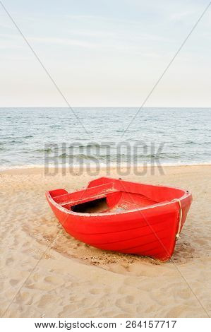 Old Red Boat On The Beach, Waves On The Water And Sky Background