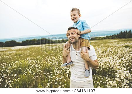 Father Spending Time With Son During The Sunset.