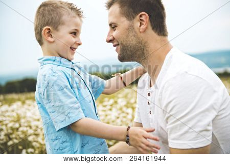 Father Spending Time With Son During The Sunset.