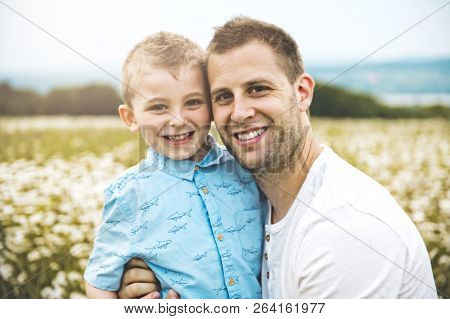 Father Spending Time With Son During The Sunset.