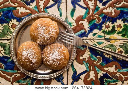 Turkish Dessert Kemalpasa On A Ottoman Pattern Surface.