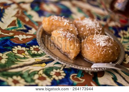 Turkish Dessert Kemalpasa On A Ottoman Pattern Surface.