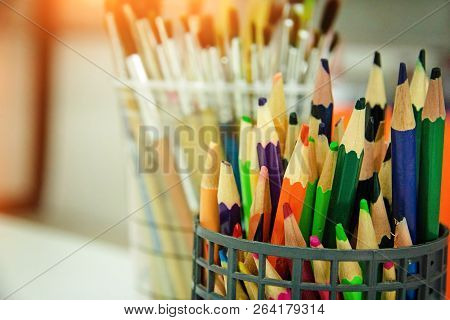 The Group Of Used Color Pencil,put In Plastic Basket,warm Lgiht Tone,blurry Light Around