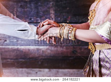 In Selective Focus Of Human Hands Touch Together,man And Woman Are Holding Hands Together,to Be Sign