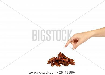 Sun Dried Red Tomatoes With Hand Isolated On White Background, Copy Space Template