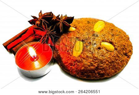 Gingerbread Nuremberg With Cinnamon And Candle Isolated On White