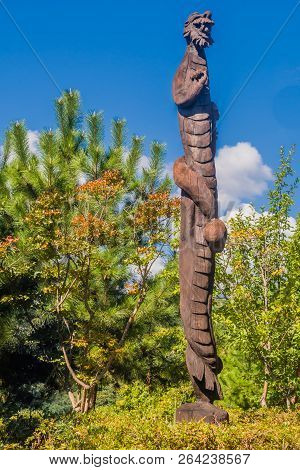 Samcheok, South Korea; September 25, 2018: Closeup Of Wooden Statue Of Bearded Man Dragon Shaped Lik