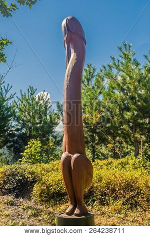 Samcheok, South Korea; September 25, 2018: Closeup Of Wooden Statue Of Human Penis Standing In Front