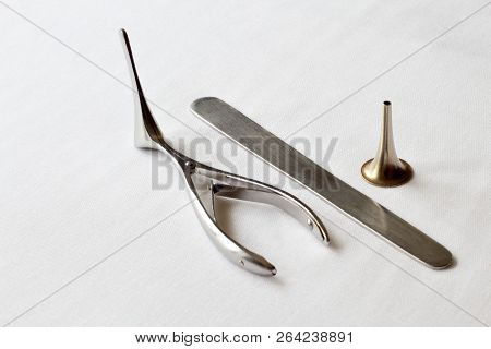 Retro. A Set Of Steel Medical Instruments For Examination Of The Ear, Throat, Nose. White Gauze Back