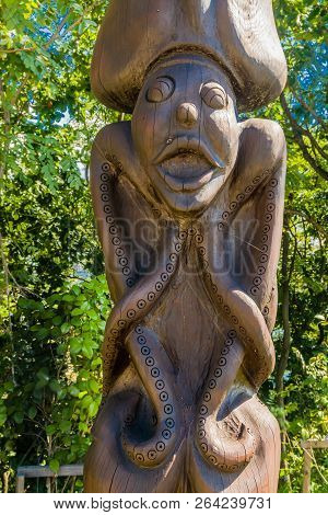 Samcheok, South Korea; September 25, 2018: Closeup Of Wooden Statue Of Person With Octopus Arms And 