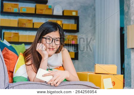 Young Asian Teenager Owner Business Woman Work At Home For Online Shopping, Checking Order And Prepa