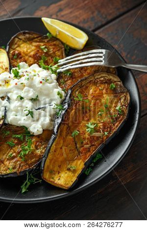 Healthy Vegeterain Oven Baked Aubergines, Eggplant With Cottage Cheese Dip, Parsley And Lemon Wedge.