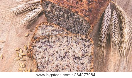 Multi-grain Bread On A Wooden Background. Healthy Food Concept.