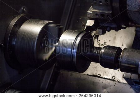 Cnc Lathe Pulls Out Part Of Metal Workpiece Pulley, Modern Lathe For Metal Processing, Close-up, Met