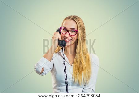 Happy Blond Woman In White Shirt And Pink Glasses Speaking On Telephone And Smiling At Camera