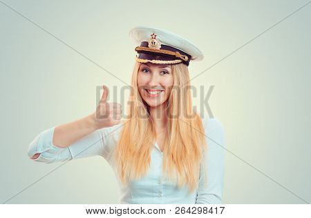 Happy Blond Woman Wearing White Shirt And Navy Service Cap Showing Thumb Up And Smiling