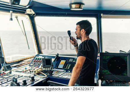 Marine Navigational Officer Is Reporting By Vhf Radio