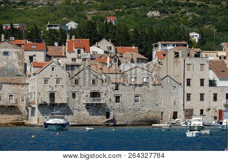 Komiza, Croatia, July 27, 2018: Komiza, A Croatian Town With 17th And 18th Century Stone Town Houses