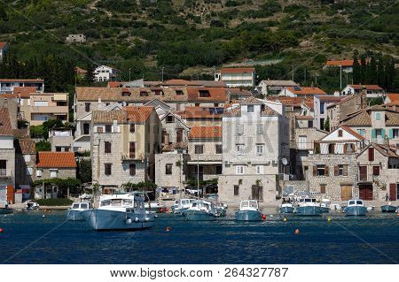 Komiza, Croatia, July 27, 2018: Komiza, A Croatian Town With 17th And 18th Century Stone Town Houses