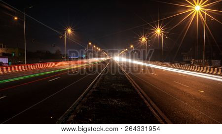 Fast Driving Vehicles Trial At Night, With Long Exposure Blurred Effect At Indian Nation Highway 19 