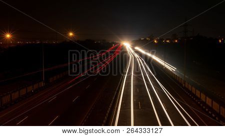 Fast Driving Vehicles Trial At Night, With Long Exposure Blurred Effect At Indian Nation Highway 19 