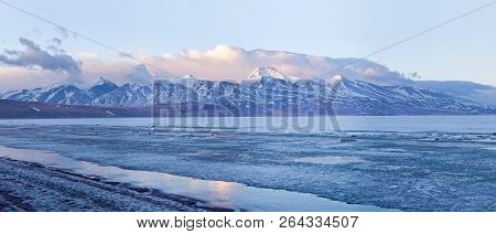 Panorama Of Gurla Mandhata Peak And Lake Rakshas Tal Under Ice In Western Tibet, China