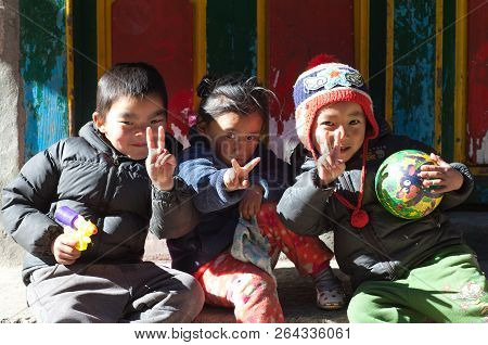 Namche Bazaar, Nepal - January 19, 2017: Nepalese Children Poses For A Photo On The Street