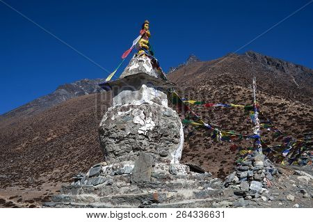 Ancient Buddhist Stupa With Prayer Flags Above Dingboche Village On The Way To Everest Base Camp, Sa