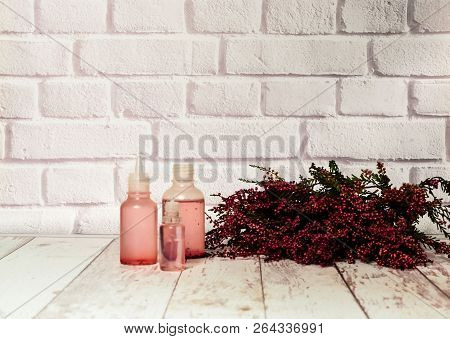 Heather And Tincture Of Heather Flowers On Light Background, The Concept Of Healing Plants, Close Up