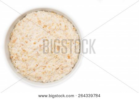 Oatmeal In White Plate On White Background. Isolated On White
