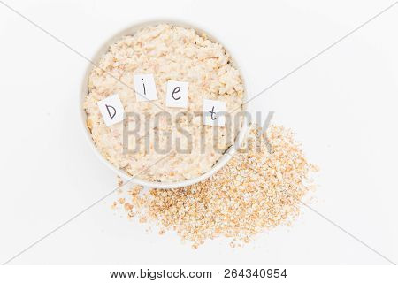 Oatmeal With Inscription Diet In White Bowl On White Background. Isolated On White. Healthy Food