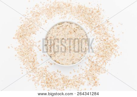 Oatmeal In White Bowl On White Background. Isolated On White. Healthy Food