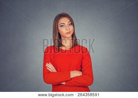 Grumpy Skeptical Woman Isolated On Gray Grey Studio Wall Background. Business Woman In Red Dress, Bo