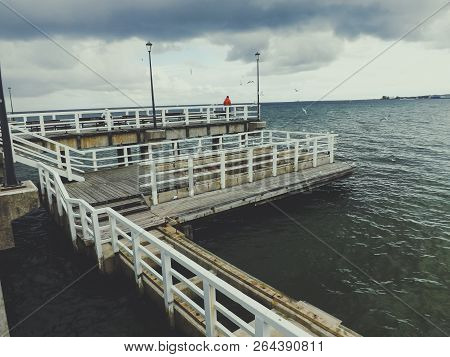 Wooden Pier On Cloudy Day. Hotizontal View