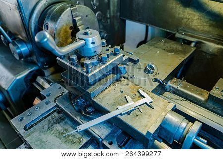 Metal Lathe Processes Metal Parts On The Production In The Plant. The Work Process Of The Lathe. Clo