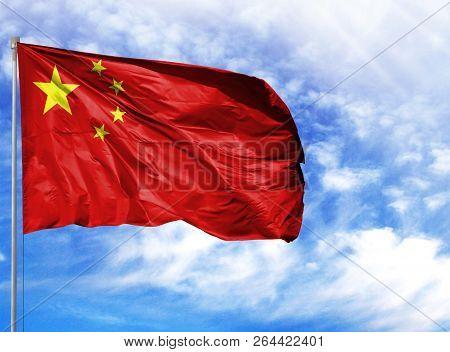 National Flag Of China On A Flagpole In Front Of Blue Sky