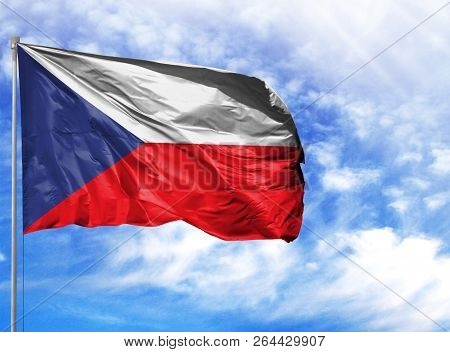 National Flag Of Czech Republic On A Flagpole In Front Of Blue Sky