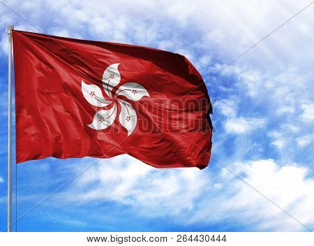 National Flag Of Hong Kong On A Flagpole In Front Of Blue Sky