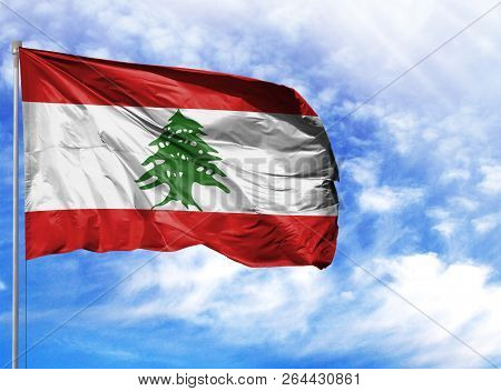 National Flag Of Lebanon On A Flagpole In Front Of Blue Sky