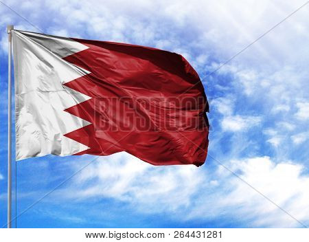 National Flag Of Bahrain On A Flagpole In Front Of Blue Sky