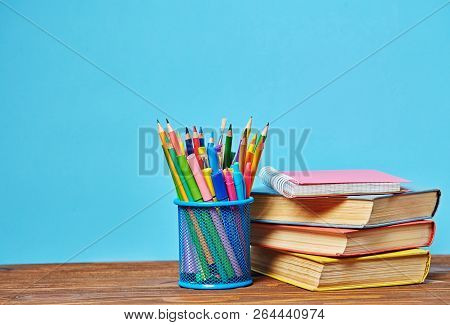 Education Concept. Colored Pencils Near The Books.