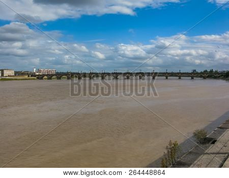 Cityscape. View Of Bordeaux River Bridge Against Cloudy Blue Sky Bordeaux, France