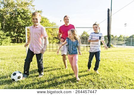 Nice Happy Family Lifestyle Play Soccer Outside