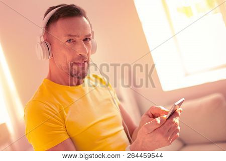 High-spirited Joyful Man Checking Social Media On The Phone