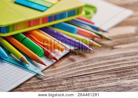 Stationery Under A Bright Notebook On The Table