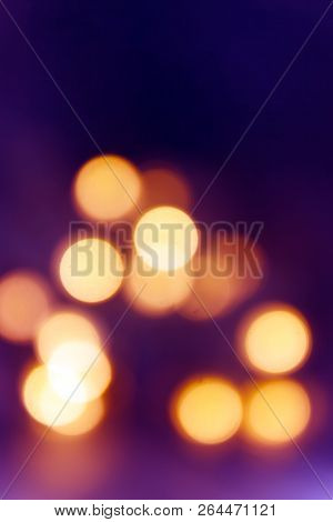 Background Of Blurry Pink-purple-lilac Lights Of The Christmas-tree Garland On The Dark. Copy Space
